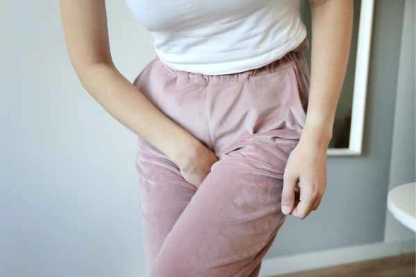 woman running for the toilet because of urinary incontinence Middlewich